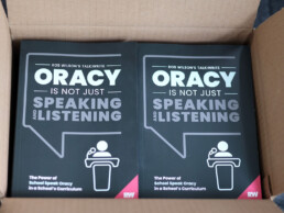 A box full of our new oracy books.